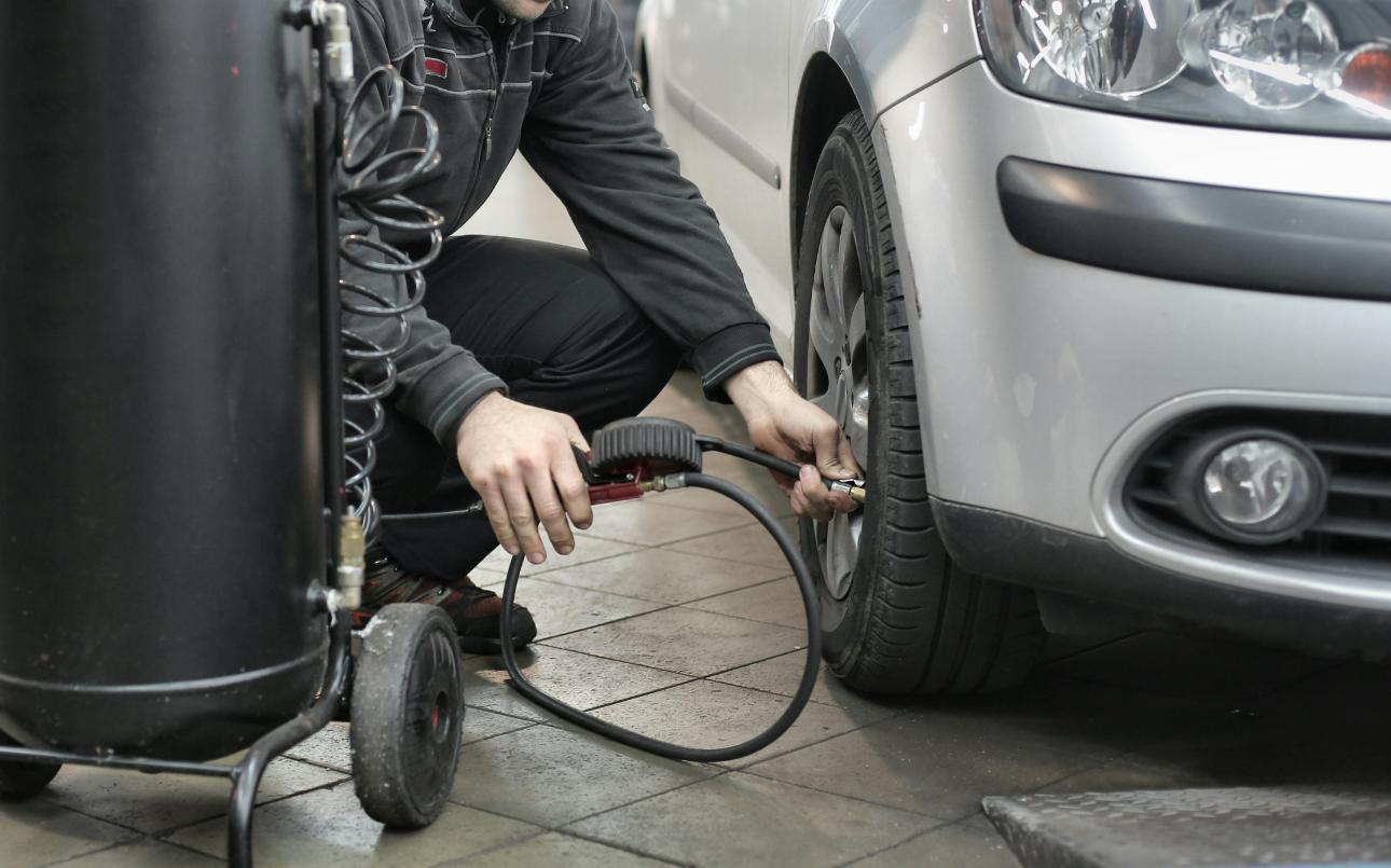 Man checking car oil level